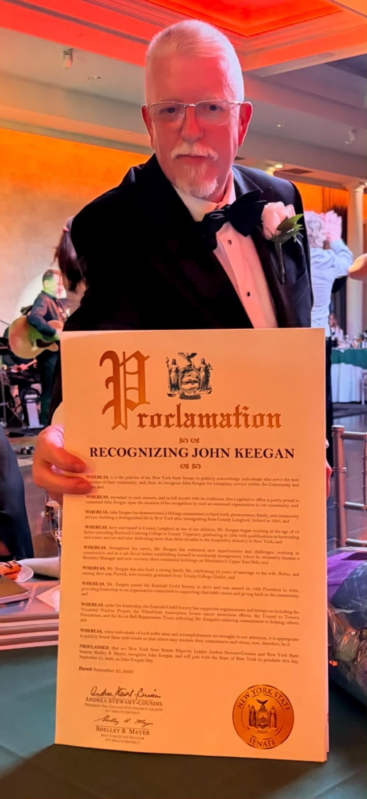 John Keegan holding his proclamation at the 2026 Aisling Center dinner dance.