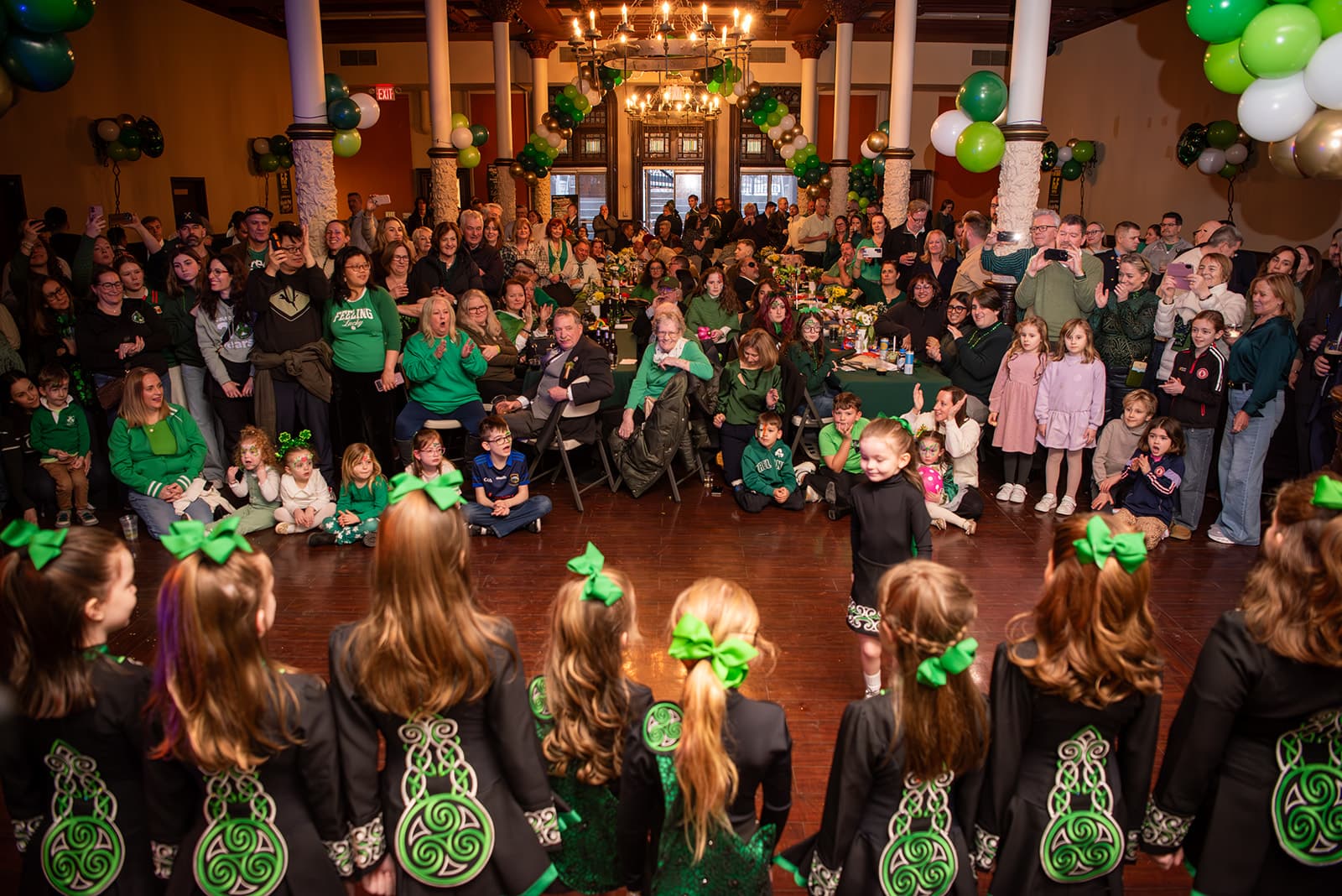 Young dancers and onlookers gathered on the floor during the Guild's 2026 St. Patrick's Day gathering.